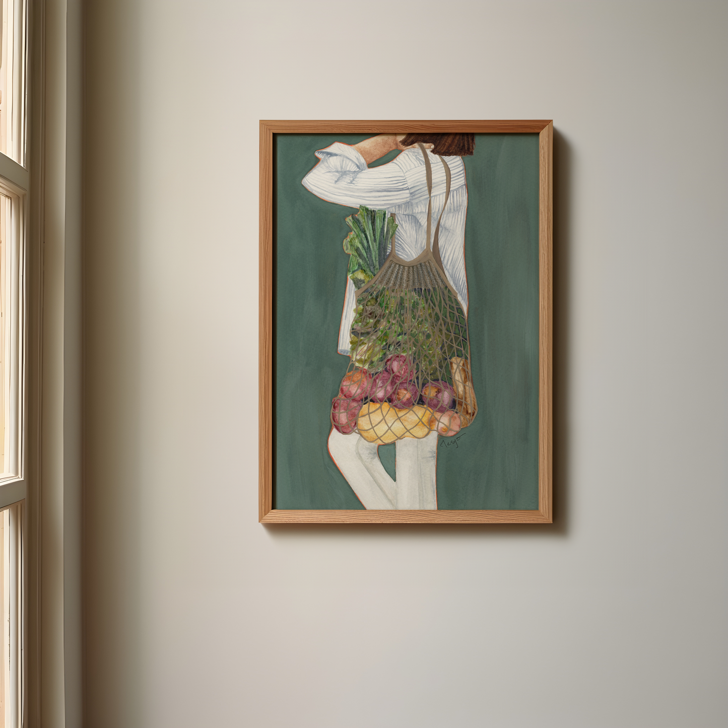 Framed wall artwork of a girl with a reusable grocery bag full of vegetables.
